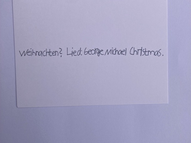 Handschriftlicher Schriftzug: Weihnachten: Lied George Michael Christmas